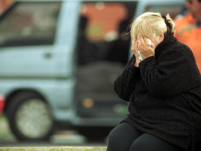 Judy Moran weeps for her slain son Jason Moran at the scene of his shooting.