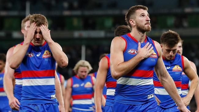 Marcus Bontempelli (right) is dejected after the loss. Picture: Michael Willson/AFL Photos via Getty Images