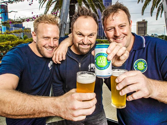 Australian Gold Medalist Steven Bradbury and son's of Rugby Union legend Roy Prosser, Damian (** this is correct spelling on Damian**) check story/ dark hair) and Stephen (blonde) at South Bank Beer Garden. Article is about their new beer, Last Man Standing and how these local sporting legends have received a large amount of public support for their new beer brand.  Picture: NIGEL HALLETT