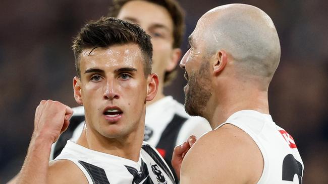 MELBOURNE, AUSTRALIA - MAY 03: Nick Daicos of the Magpies celebrates a goal with teammate Steele Sidebottom during the 2024 AFL Round 08 match between the Carlton Blues and the Collingwood Magpies at The Melbourne Cricket Ground on May 03, 2024 in Melbourne, Australia. (Photo by Dylan Burns/AFL Photos via Getty Images)