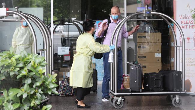 A passenger from Singapore arrives at the Pullman medi-hotel in December last year. Picture: Tait Schmaal