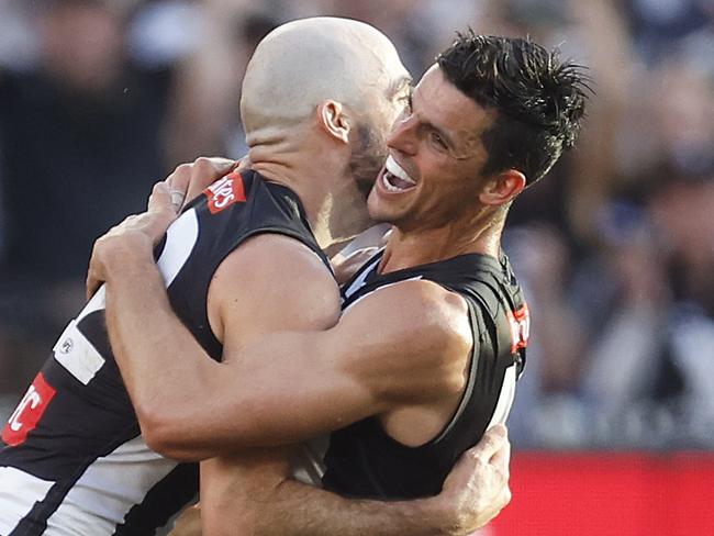 MELBOURNE, AUSTRALIA - SEPTEMBER 30: Steele Sidebottom of the Magpies celebrates with Scott Pendlebury of the Magpies after kicking a goal during the 2023 AFL Grand Final match between Collingwood Magpies and Brisbane Lions at Melbourne Cricket Ground, on September 30, 2023, in Melbourne, Australia. (Photo by Daniel Pockett/AFL Photos/via Getty Images)