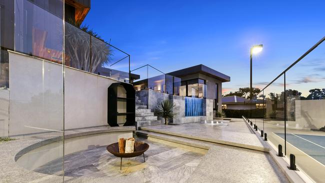 Sprawling outdoor space includes a fire pit.