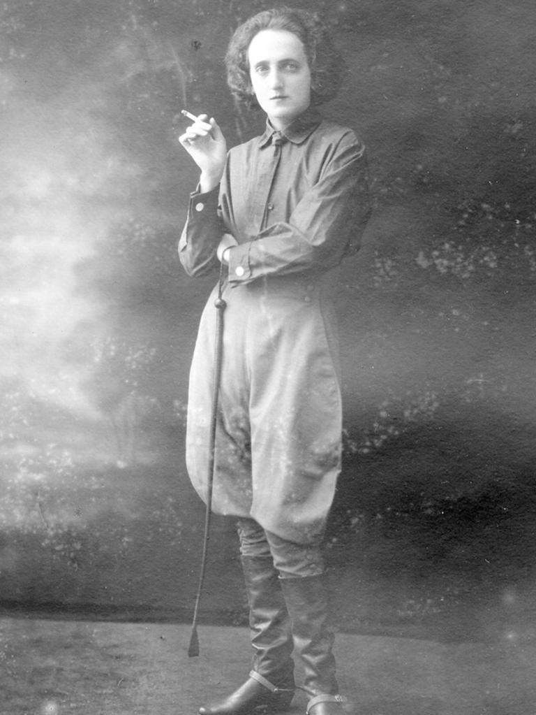 A woman wearing a riding costume of shirt, breeches and leather boots, photographed circa-1920. Picture: State Library of SA Searcy Collection