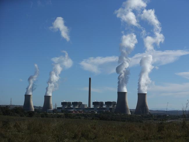 05/05/2023. Gerard Spinks, 59, Bayswater plant assistant manager, has worked in coal fired plants for more than four decades and is concerned about what will happen to workers as the economy detransitions. Photographed with  Bayswater Power station in the background, 15 minutes south of Muswellbrook in NSW. Britta Campion / The Australian