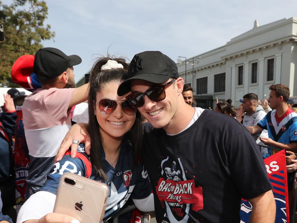 Rebecca Warian and Sam Verrills pictured at the Sydney Roosters fan morning at Moore Park after the Roosters win in the 2019 NRL Grand Final. Picture: Richard Dobson