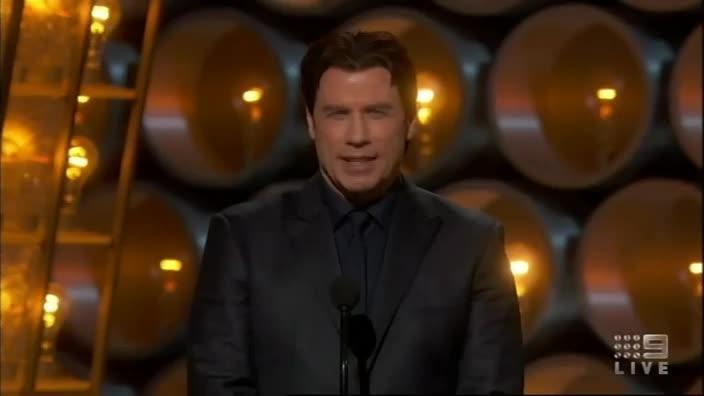 At the Oscars, Travolta and Menzel make light of last year's gaffe