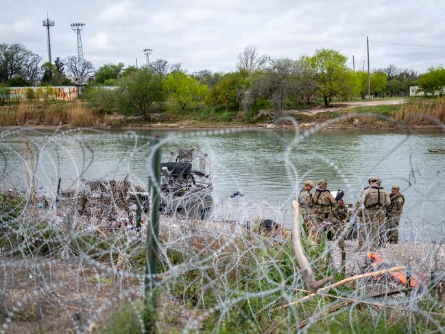 Members of the Texas National Guard on the banks of the Rio Grande. Picture: Sergio Flores