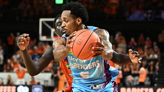 Barry Brown Jr of the Breakers under pressure from Bul Kuol of the Taipans during round four NBL match between Cairns Taipans and New Zealand Breakers at Cairns Convention Centre. Picture: Emily Barker