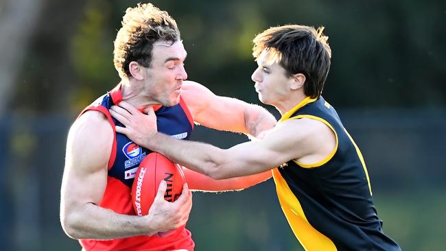 Tapscott fights off a tackler. (Photo by Josh Chadwick)