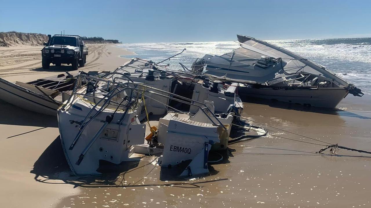 A yacht, which sank in the Wide Bay Bar on Monday night and left two occupants in freezing cold waters, has washed up on the north arm of Fraser Island the day after it went under. Photo: Rainbow Recovery, Repairs and Services