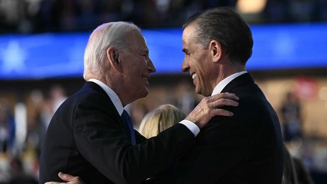 (FILES) US President Joe Biden and his son Hunter Biden hug on stage at the conclusion of the first day of the Democratic National Convention (DNC) at the United Center in Chicago, Illinois, on August 19, 2024. US President Joe Biden has signed a pardon for his son Hunter Biden, according to a statement issued on December 1, 2024. (Photo by Brendan SMIALOWSKI / AFP)