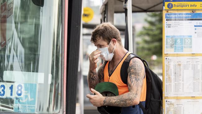 People pictured wearing masks on public transport, Campbell parade Bondi on Monday. Picture: Monique Harmer