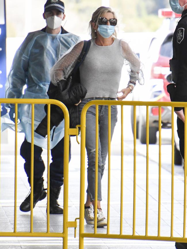 Police escorted Hopkins through the airport. Picture: Media Mode