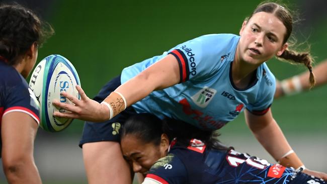 Caitlyn Halse of the Waratahs passes the ball during the Super W match between Melbourne Rebels Women and NSW Waratahs.