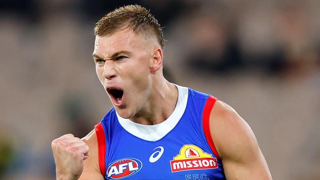 MELBOURNE - APRIL 08: Robbie McComb of the Bulldogs celebrates a goal during the 2023 AFL Round 04 match between the Richmond Tigers and the Western Bulldogs at the Melbourne Cricket Ground on April 8, 2023 in Melbourne, Australia. (Photo by Dylan Burns/AFL Photos via Getty Images)