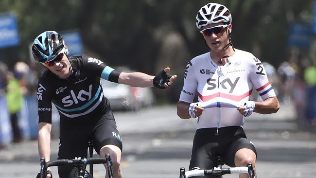 Chris Froome (L) congratulates teammate Peter Kennaugh.