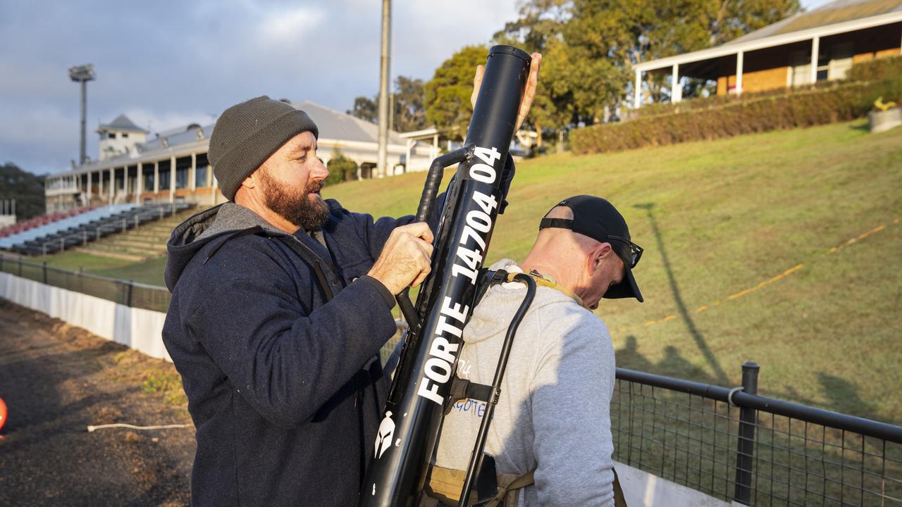 Duncan Miller (left) loads Spartans team member Geordie Horn up with his extra 40kg for the 40 for Fortey at Toowoomba Showgrounds, Sunday, June 2, 2024. Picture: Kevin Farmer