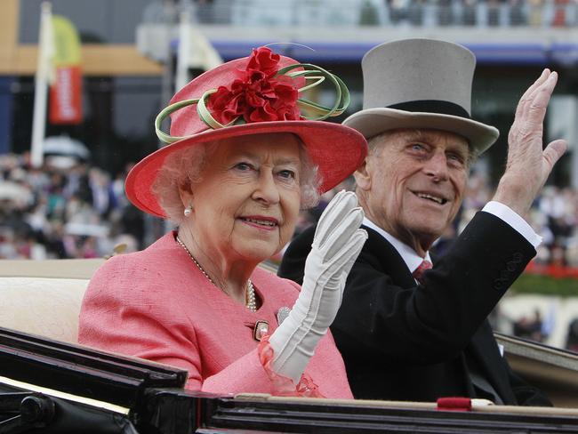 Britain's Queen Elizabeth II with Prince Philip arrive by horse drawn carriage in the parade ring on the third day, traditionally known as Ladies Day, of the Royal Ascot horse race meeting. Picture: AP