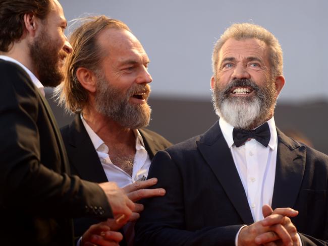 Luke Bracey, Mel Gibson and Hugo Weaving arrive for the premiere of “Hacksaw Ridge” presented out competition at the 73rd Venice Film Festival on September 4, 2016. Picture: AFP