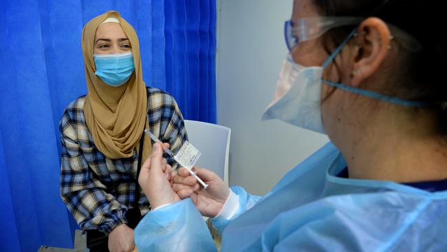 Kamar Dandan receives her Covid jab at a pop-up site in Newport. Picture: Andrew Henshaw