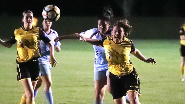 Strikers' Jordan Cunsamy pushes Tiers' Laura Jane Williams in the FNQ Premier League women's match between the JCU Strikers and the Edge Hill Tigers, held at JCU Oval, Smithfield. PICTURE: BRENDAN RADKE.