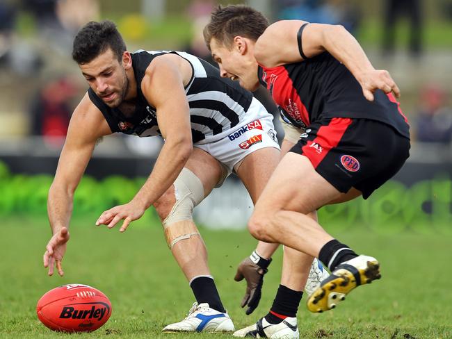 Port's Jimmy Toumpas and West's Aaron Fielke compete for the ball. Picture: TOM HUNTLEY