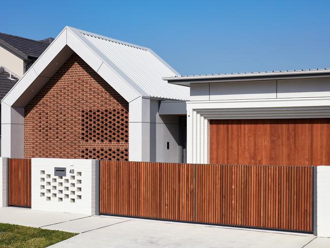 Intricate brickwork and peepholes gives the facade a modern take on an orthodox material