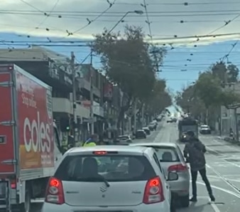 Driver shown in confrontation with Coles worker.