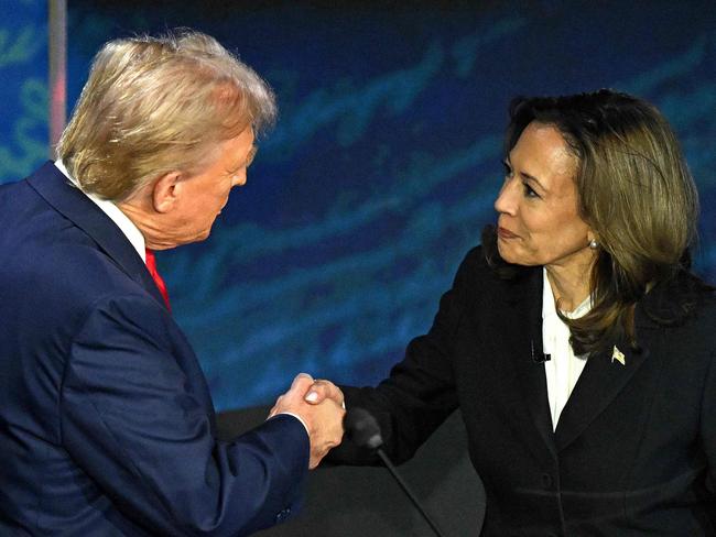 US Vice President and Democratic presidential candidate Kamala Harris (R) shakes hands with former US President and Republican presidential candidate Donald Trump during a presidential debate at the National Constitution Center in Philadelphia, Pennsylvania, on September 10, 2024. (Photo by SAUL LOEB / AFP)