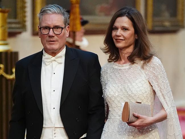 LONDON, ENGLAND - JUNE 25: Labour leader Sir Keir Starmer with his wife Victoria Starmer make their way along the East Gallery to attend the State Banquet for Emperor Naruhito and his wife Empress Masako of Japan at Buckingham Palace on June 25, 2024 in London, England. The Japanese royal couple arrived in Britain for a three-day state visit hosted by King Charles III. (Photo by Aaron Chown - WPA Pool/Getty Images)