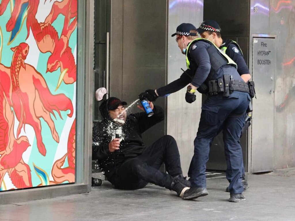 A man is pepper sprayed by police. Picture: Jason Edwards