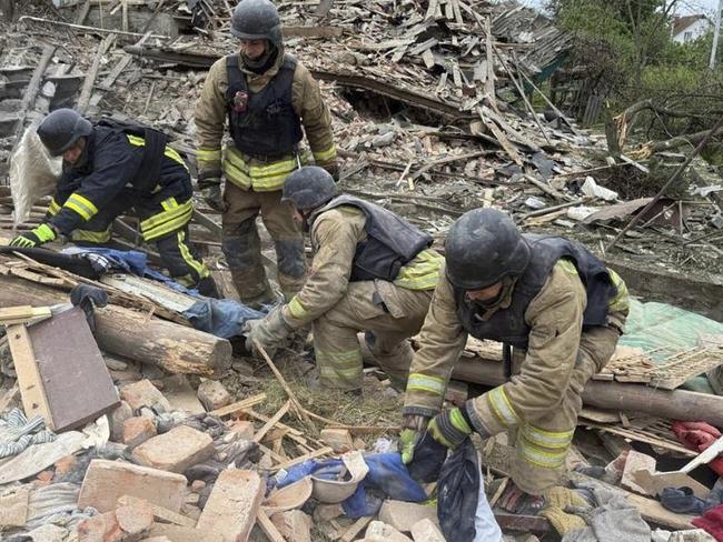 In this photo provided by the Ukrainian Emergency Service, firefighters search for victims following a Russian air attack in Zhitomir region, Ukraine on May 25. Picture: Ukrainian Emergency Service via AP
