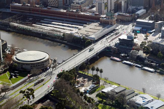 Aerial pictures of empty roads in Melbourne as strict stage 4 lockdowns are enforced. St Kilda road bridge and the Yarra River. Aaron Francis/The Australian