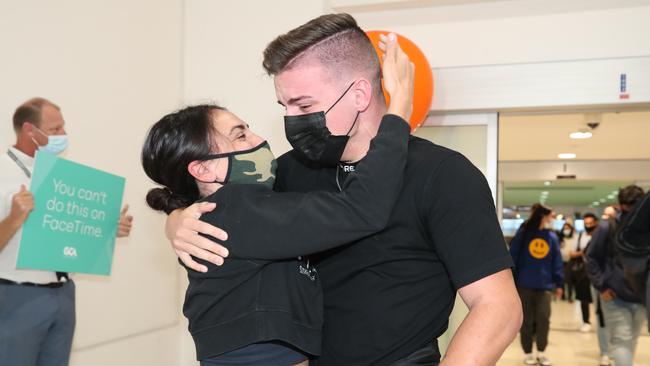 Sophie Forkgen hugs her friend Luke Donnelly at the Gold Coast Airport. Picture Glenn Hampson