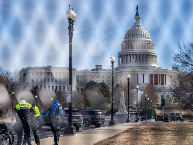 New York Police Department and US Capitol Police officers are seen near the US Capitol building ahead of the January 6th certification of the 2024 Presidential Election in Congress. Picture: Allison Robbert/AFP