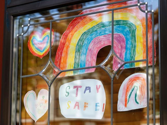 Home made signs of support for the NHS and care workers in the windows of people's homes in Walthamstow, north London. Picture: AFP