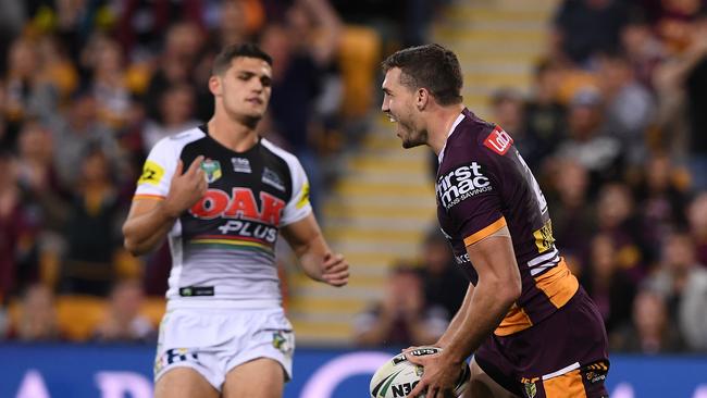 Corey Oates of the Broncos celebrates after scoring a try during the Round 19 NRL match between the Brisbane Broncos and the Penrith Panthers at Suncorp Stadium in Brisbane, Friday, July 20, 2018. (AAP Image/Dave Hunt) NO ARCHIVING, EDITORIAL USE ONLY