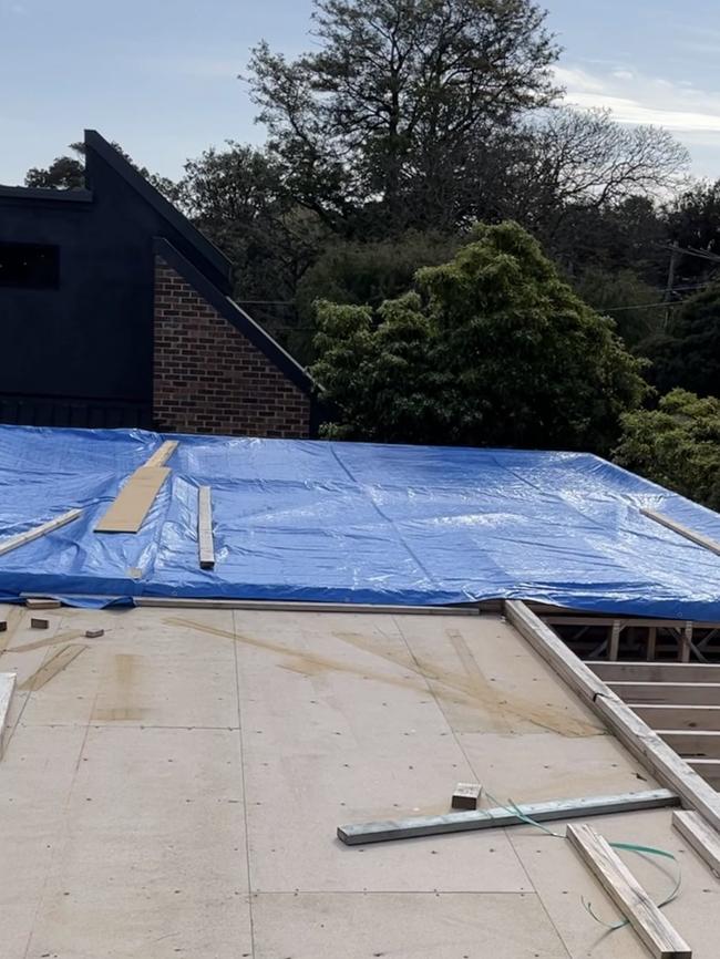 One homeowner was forced to cover the structure with tarps. Picture: Supplied