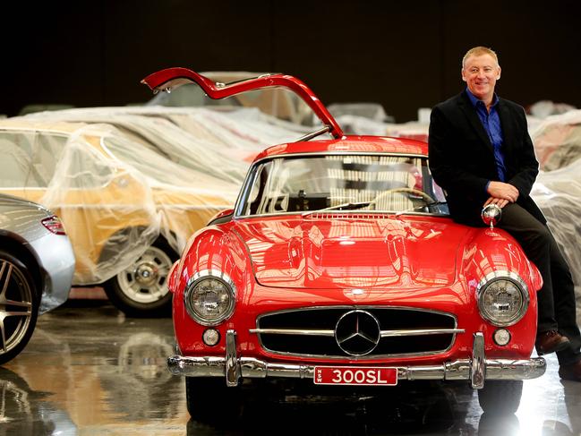 Happier times. Mr Denny pictured with 300SLGullwing 1955 ahead of its grand opening. Photo: Sue Graham