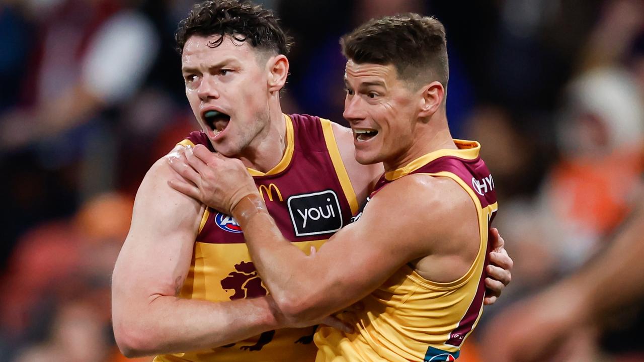 Lachie Neale and Dayne Zorko celebrate a goal. Picture: Dylan Burns/AFL Photos via Getty Images