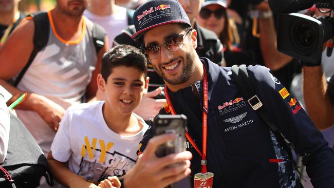 Formula 1 driver Daniel Ricciardo and a young fan