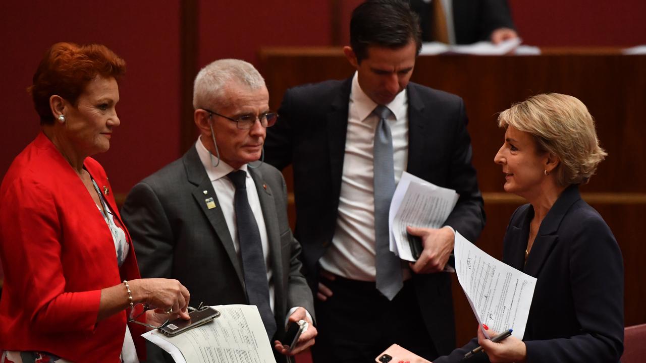 Senators Pauline Hanson, Malcolm Roberts, Simon Birmingham and Michaelia Cash talk during debate on industrial relations reforms in the Senate on Thursday. Picture: Sam Mooy/Getty Images