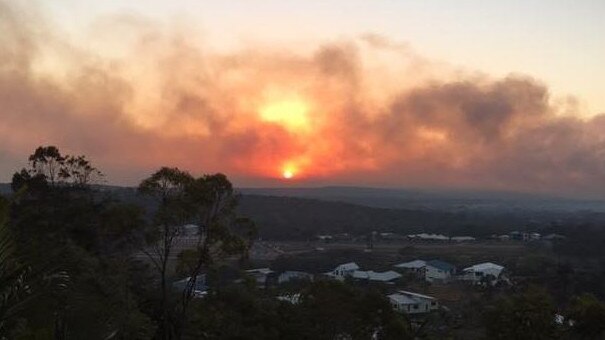 The fire seen lingering over Deepwater. Picture: Mary Rodwell