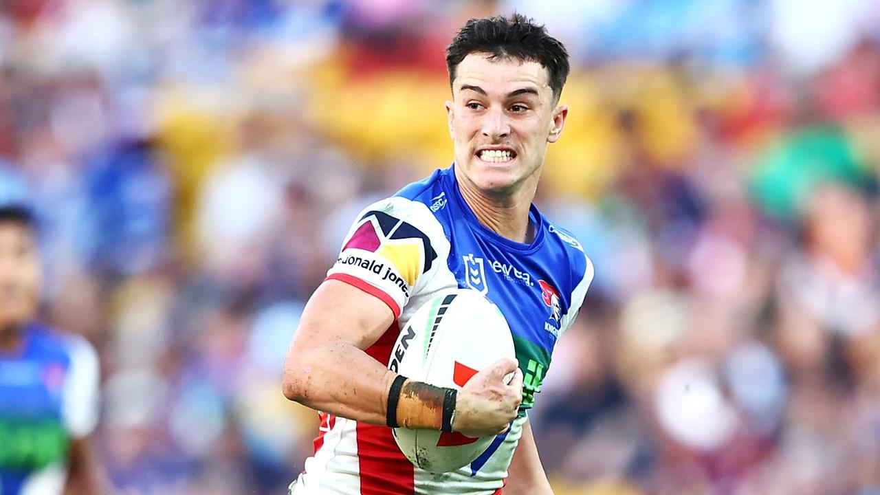 BRISBANE, AUSTRALIA - MAY 18: David Armstrong of the Knights breaks a way to score a try during the round 11 NRL match between Gold Coast Titans and Newcastle Knights at Suncorp Stadium, on May 18, 2024, in Brisbane, Australia. (Photo by Chris Hyde/Chris Hyde)