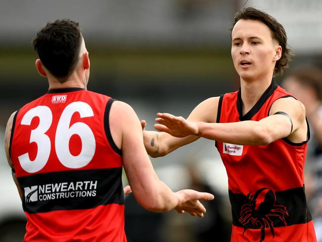 Nathan Rayment of Romsey is congratulated by team mates after kicking a goal during the round 16 Riddell District Football Netball League 2023 Bendigo Bank Seniors match between Romsey and Macedon at Romsey Park in Romsey, Victoria on August 5, 2023. (Photo by Josh Chadwick)