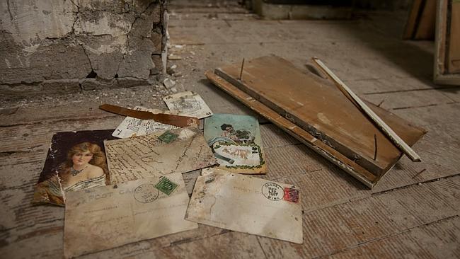 Some of the postcards Amanda Reddy discovered beneath her floorboards. Photo: Amanda Reddy