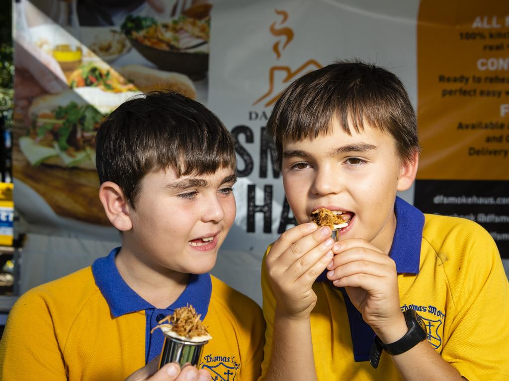 Nicholas (left) and Jaxson May sample Darling Fresh Smoke Haus produce at the Locals 4 Locals summer edition on the lawn of Empire Theatres, Friday, February 18, 2022. Picture: Kevin Farmer