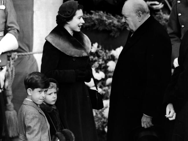 Queen Elizabeth (pictured in 1953 with Prince Charles and Princess Anne meeting Sir Winston Churchill) has endured through many leaders and world events. Picture: Central Press.