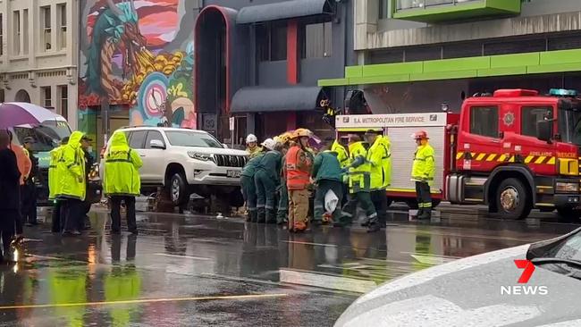 A young girl and woman have been rushed to hospital after being hit by a car during peak hour on Angas Street. Major Crash officers are investigating. Picture: 7NEWS